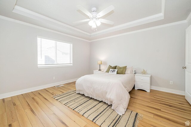 466 W 1595 N Unit 45-103, Logan, UT 84341 - bedroom with a tray ceiling, light wood-type flooring, ornamental molding, baseboards, and ceiling fan