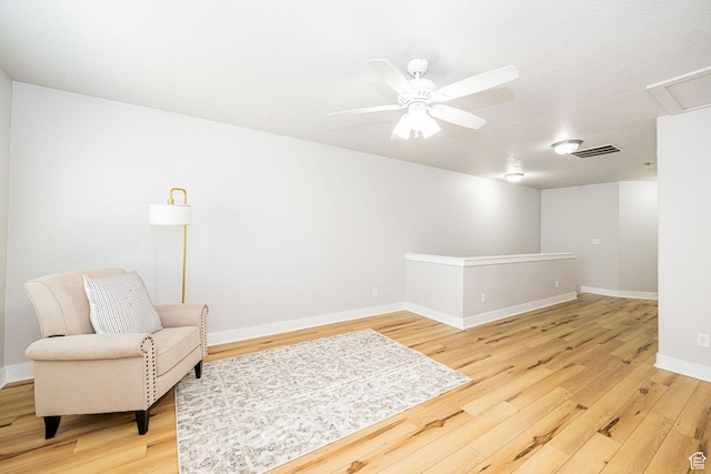 466 W 1595 N Unit 45-103, Logan, UT 84341 - living area featuring light wood finished floors, a ceiling fan, and baseboards