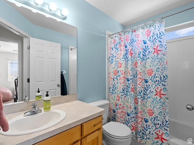 full bathroom with toilet and vanity