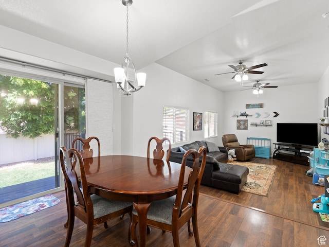 dining space featuring dark wood-type flooring, a ceiling fan, and a chandelier