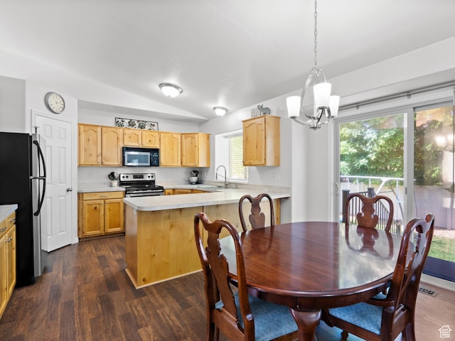 dining room with vaulted ceiling, dark wood-type flooring, and a chandelier