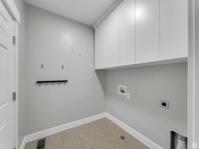 10342 S Millerton Dr, South Jordan, UT 84009 - laundry area featuring cabinet space, electric dryer hookup, baseboards, washer hookup, and light tile patterned flooring