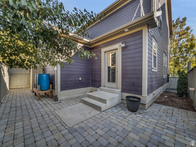 10342 S Millerton Dr, South Jordan, UT 84009 - back of house featuring a gate and a patio area
