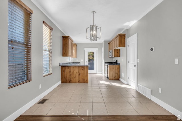 10342 S Millerton Dr, South Jordan, UT 84009 - kitchen featuring stainless steel appliances, dark countertops, a chandelier, a peninsula, and brown cabinets