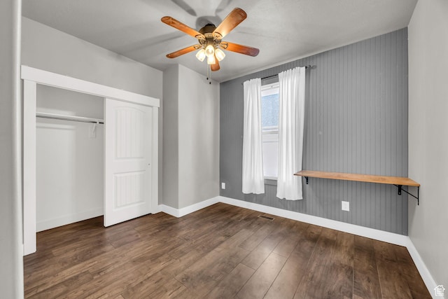 10342 S Millerton Dr, South Jordan, UT 84009 - unfurnished bedroom with baseboards, wood finished floors, a closet, and a ceiling fan