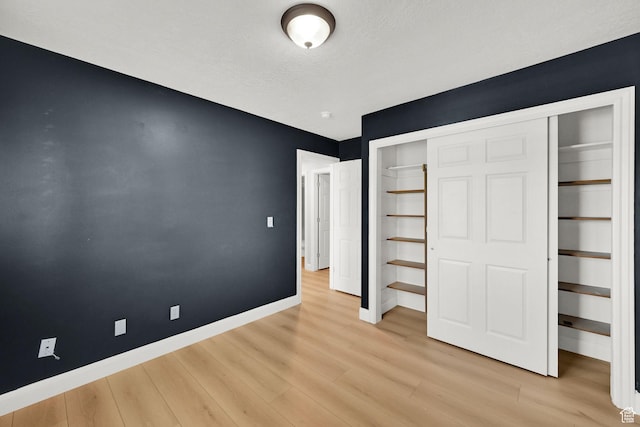1383 N 4350 W, West Point, UT 84015 - unfurnished bedroom with light wood-type flooring, baseboards, and a closet