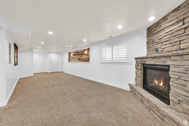 1383 N 4350 W, West Point, UT 84015 - below grade area featuring carpet floors, a stone fireplace, recessed lighting, and baseboards