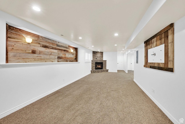 1383 N 4350 W, West Point, UT 84015 - unfurnished living room featuring a fireplace, carpet floors, recessed lighting, baseboards, and wood walls