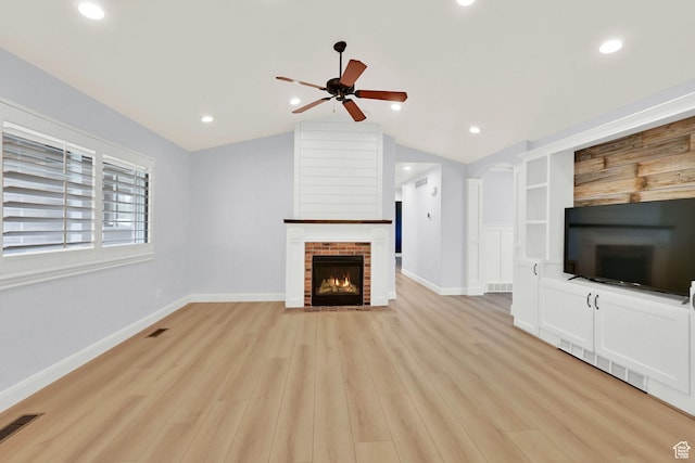 1383 N 4350 W, West Point, UT 84015 - unfurnished living room with a fireplace, ceiling fan, vaulted ceiling, light wood finished floors, and baseboards