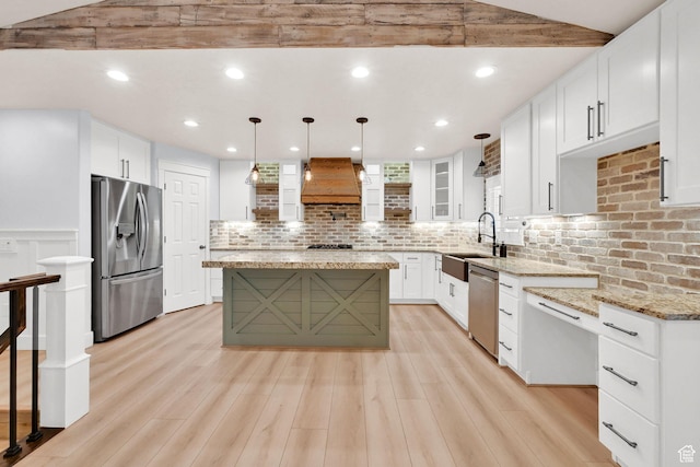1383 N 4350 W, West Point, UT 84015 - kitchen with appliances with stainless steel finishes, a sink, tasteful backsplash, custom range hood, and light stone countertops