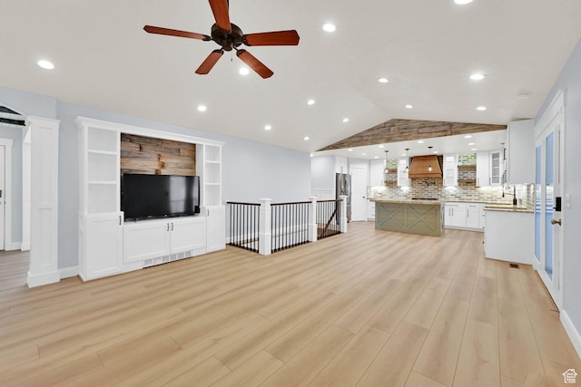 1383 N 4350 W, West Point, UT 84015 - unfurnished living room with vaulted ceiling, a ceiling fan, light wood-style flooring, and recessed lighting