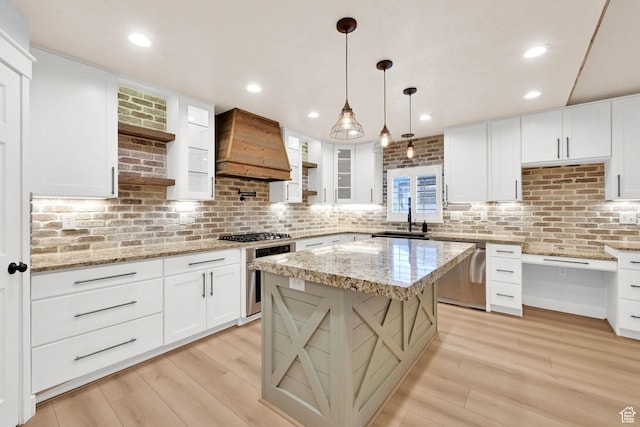 1383 N 4350 W, West Point, UT 84015 - kitchen featuring premium range hood, stainless steel appliances, tasteful backsplash, light wood finished floors, and recessed lighting