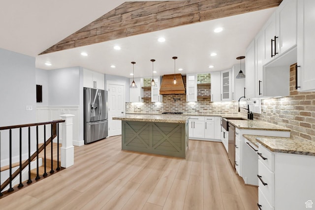 1383 N 4350 W, West Point, UT 84015 - kitchen with stainless steel appliances, custom exhaust hood, a sink, light wood-style flooring, and light stone counters