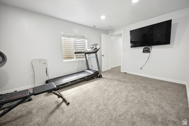 exercise area featuring carpet floors, baseboards, and recessed lighting