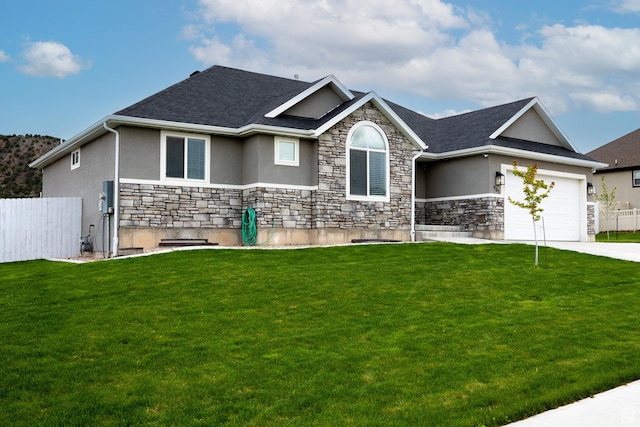ranch-style house featuring stucco siding, stone siding, an attached garage, and driveway