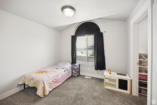 bedroom with carpet and baseboards