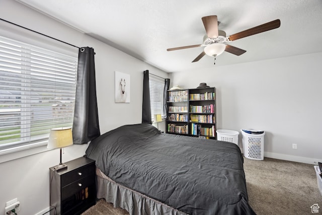 bedroom with carpet floors, ceiling fan, and baseboards