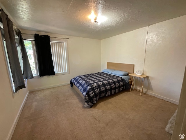 297 E 470 S, Salina, UT 84654 - carpeted bedroom with baseboards and a textured ceiling