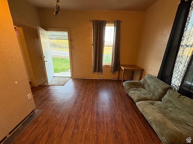 297 E 470 S, Salina, UT 84654 - living room featuring wood finished floors, healthy amount of natural light, baseboards, and a textured wall