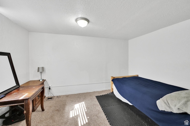 815 E 22nd St, Ogden, UT 84401 - bedroom featuring carpet flooring, a textured ceiling, and baseboards