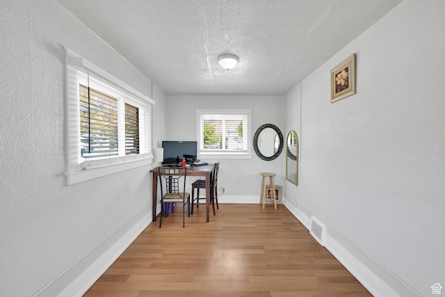 815 E 22nd St, Ogden, UT 84401 - office with a textured ceiling, wood finished floors, baseboards, and a textured wall