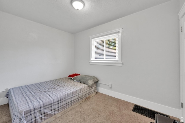 815 E 22nd St, Ogden, UT 84401 - bedroom featuring carpet, baseboards, and a textured ceiling