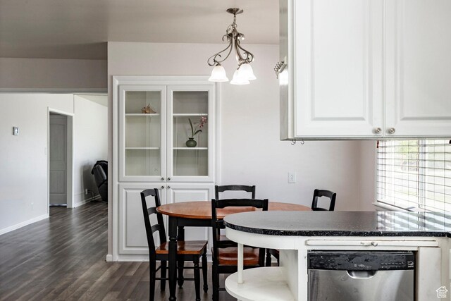 395 N 1st St, Tooele, UT 84074 - dining space featuring dark wood finished floors, baseboards, and a chandelier