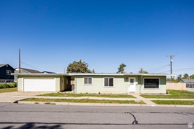 395 N 1st St, Tooele, UT 84074 - single story home featuring a garage, driveway, and fence