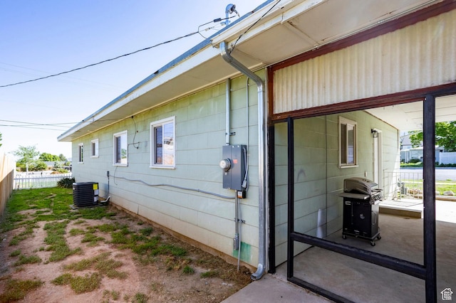 395 N 1st St, Tooele, UT 84074 - view of property exterior with central AC and fence