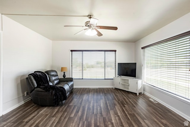 395 N 1st St, Tooele, UT 84074 - living area with dark wood-style floors, baseboards, and a ceiling fan