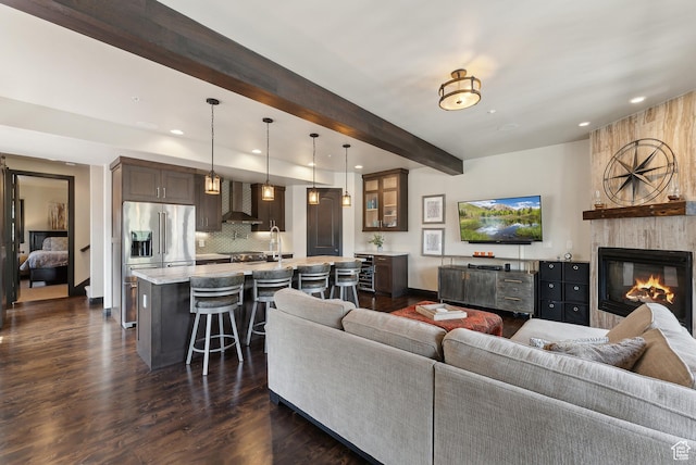 3029 Canyon Links Dr, Park City, UT 84098 - living area with beamed ceiling, recessed lighting, dark wood-type flooring, a fireplace, and baseboards