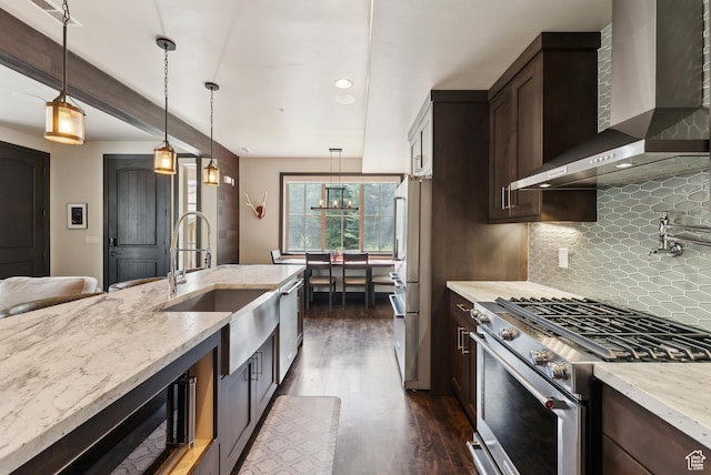 3029 Canyon Links Dr, Park City, UT 84098 - kitchen featuring appliances with stainless steel finishes, wall chimney range hood, a sink, dark brown cabinets, and dark wood-type flooring
