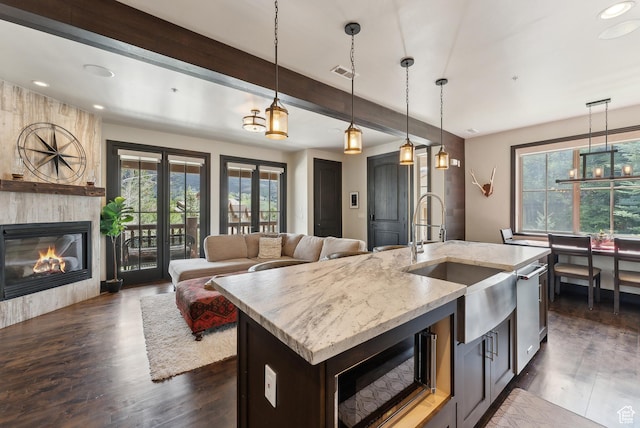 3029 Canyon Links Dr, Park City, UT 84098 - kitchen featuring a sink, plenty of natural light, dark wood-type flooring, light stone countertops, and recessed lighting