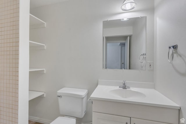 bathroom with vanity and toilet