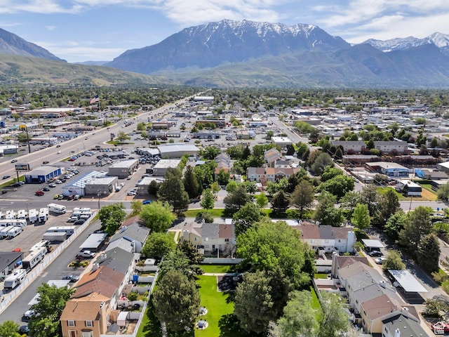 aerial view of residential area featuring a mountain backdrop