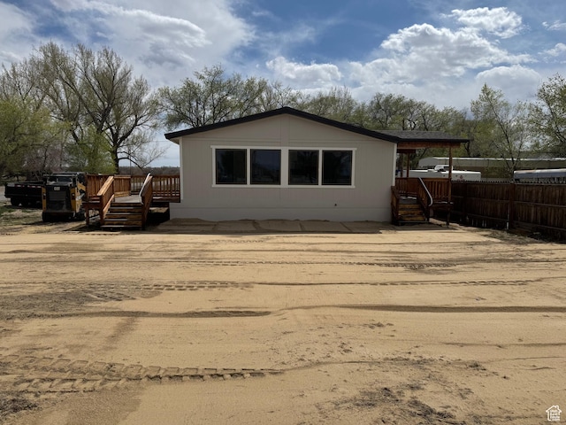 22 S 400 E, Myton, UT 84052 - back of house with a wooden deck and fence