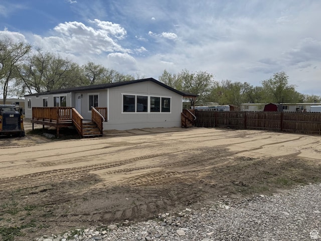 22 S 400 E, Myton, UT 84052 - rear view of house with fence and a wooden deck