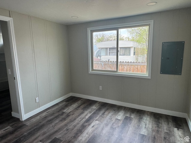 22 S 400 E, Myton, UT 84052 - spare room with electric panel, dark wood finished floors, baseboards, and a decorative wall