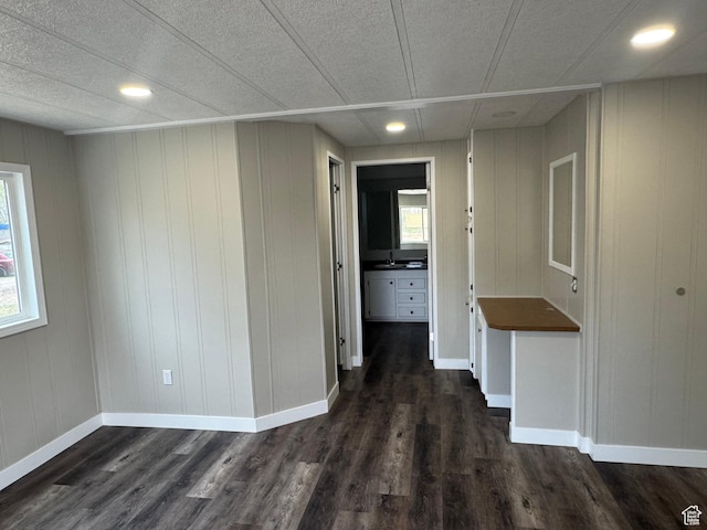 22 S 400 E, Myton, UT 84052 - empty room with dark wood-style floors, plenty of natural light, a sink, and recessed lighting