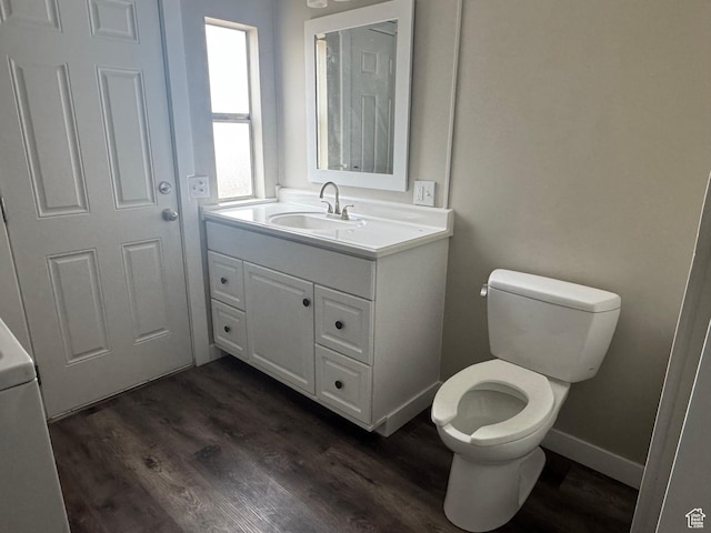 22 S 400 E, Myton, UT 84052 - bathroom with toilet, wood finished floors, vanity, and baseboards