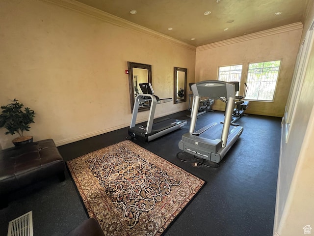 exercise area featuring ornamental molding, baseboards, and recessed lighting