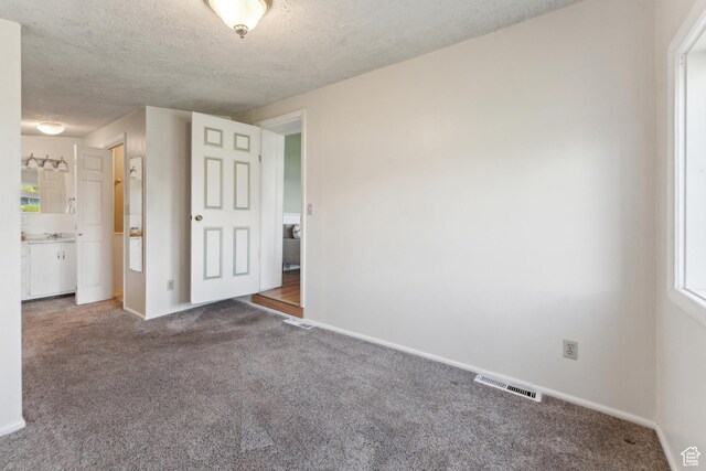 755 42nd St, South Ogden, UT 84403 - spare room featuring carpet floors, a textured ceiling, and baseboards