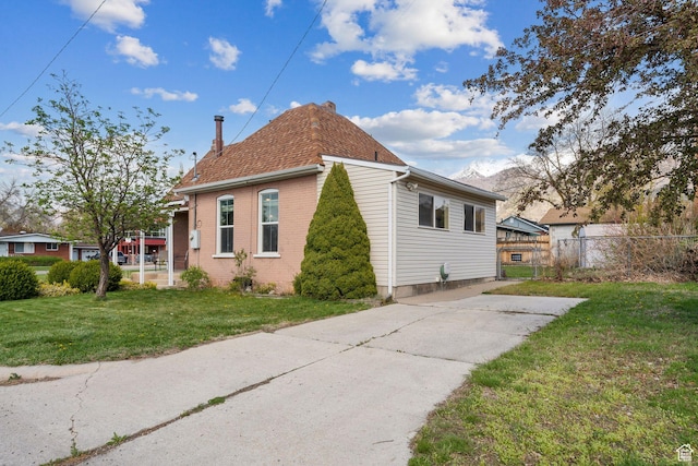 755 42nd St, South Ogden, UT 84403 - view of home's exterior with a chimney, driveway, and brick siding