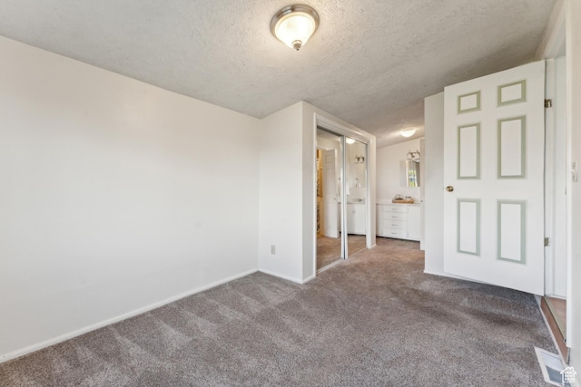 755 42nd St, South Ogden, UT 84403 - unfurnished bedroom with carpet floors, a textured ceiling, baseboards, and ensuite bathroom