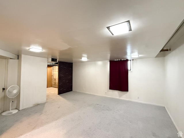 finished basement featuring carpet flooring and baseboards