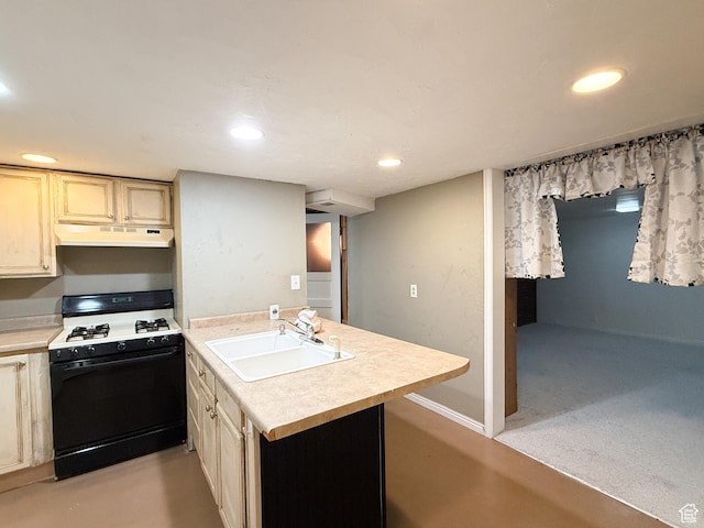 kitchen featuring black range with gas cooktop, a sink, a peninsula, under cabinet range hood, and light countertops