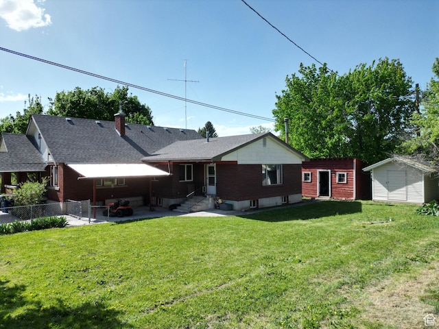 back of house featuring entry steps, a patio, a storage shed, and an outdoor structure