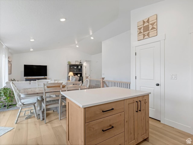 1245 N Clemente Way, Tooele, UT 84074 - kitchen featuring light wood-style flooring, lofted ceiling, light brown cabinets, a center island, and recessed lighting