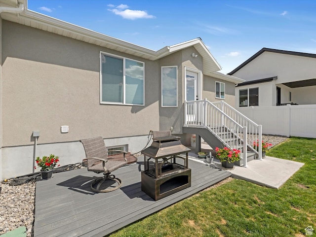 1245 N Clemente Way, Tooele, UT 84074 - rear view of house featuring stucco siding and a deck