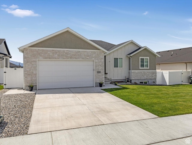 1245 N Clemente Way, Tooele, UT 84074 - ranch-style home with a gate, stone siding, driveway, a garage, and board and batten siding